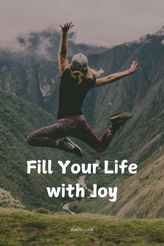 Woman jumping high in the mountains, with the quote 'Fill your life with joy', illustrates what is fulfillment.