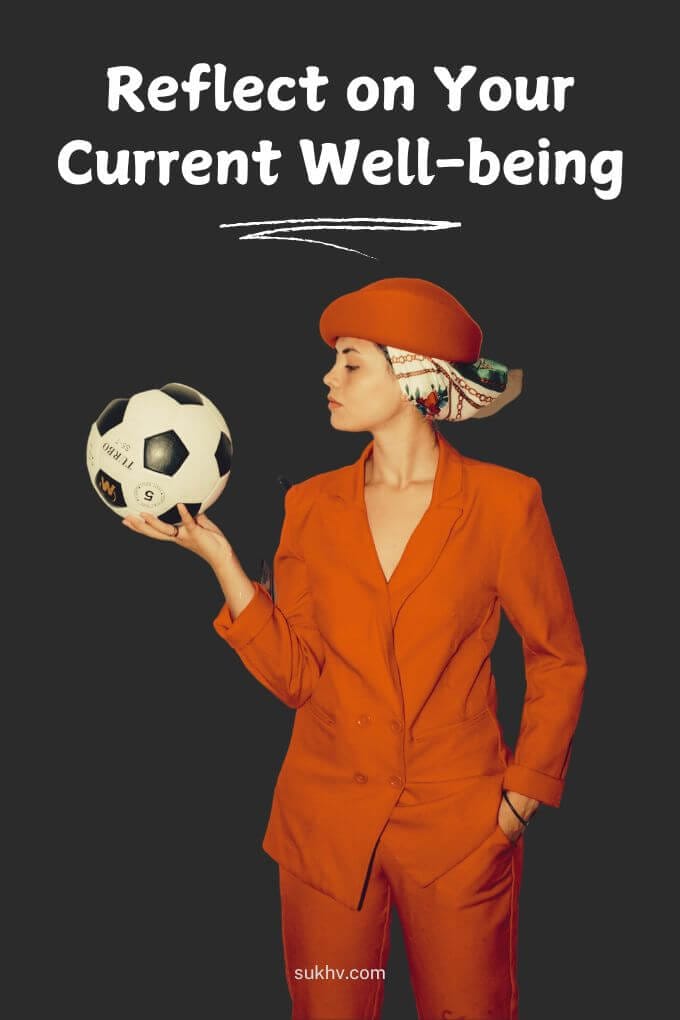 Woman in red examines the ball in her hand with the text message 'Reflect on your current well-being'.